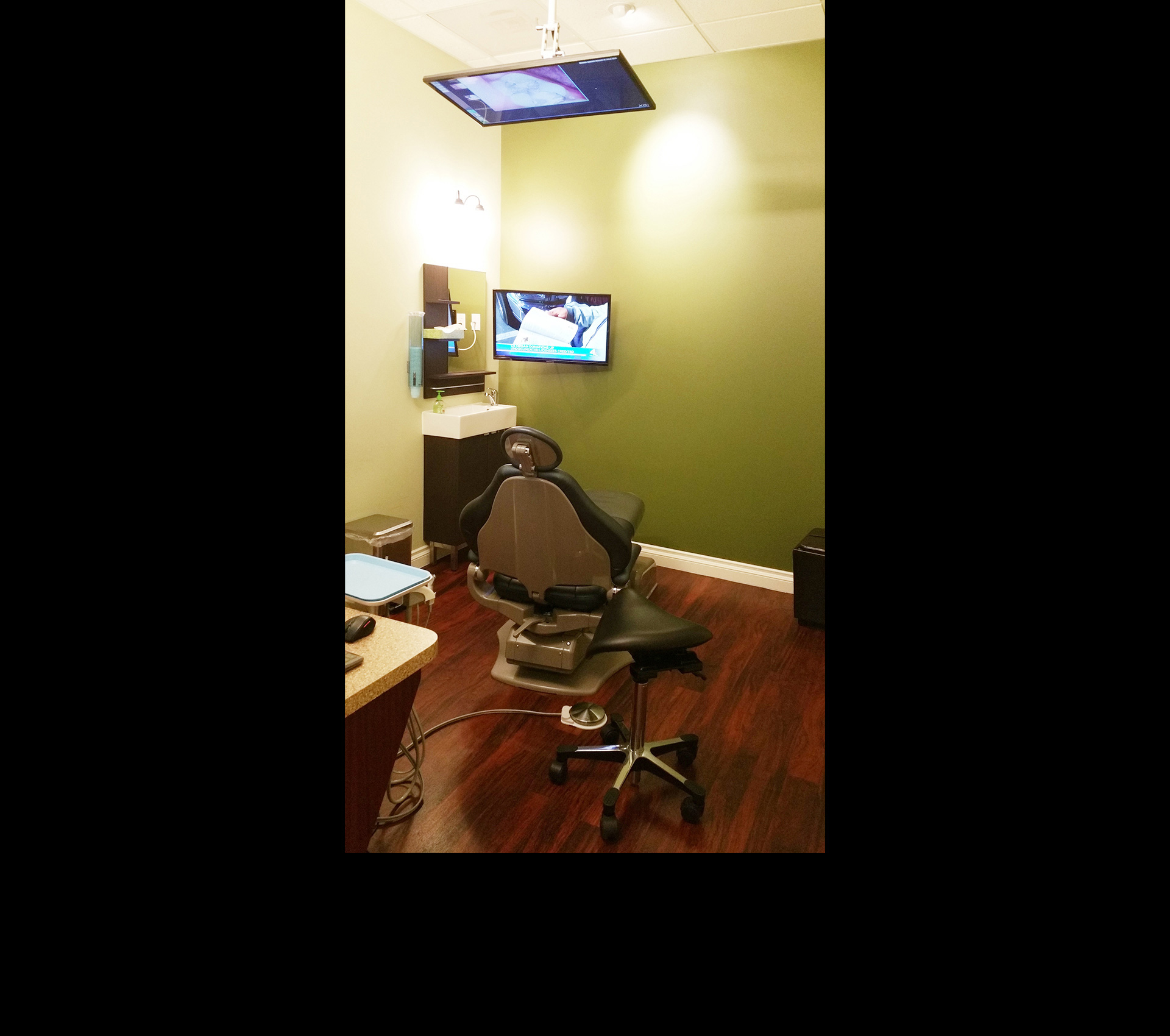 Our operatories are set up in such way that you can see a live view of inside your mouth or your X-rays while you are lying down. We can also switch to a satellite TV to tune to your favorite show/channel. If you happen to wait just a bit to start your treatment, you can watch TV while sitting up as well.